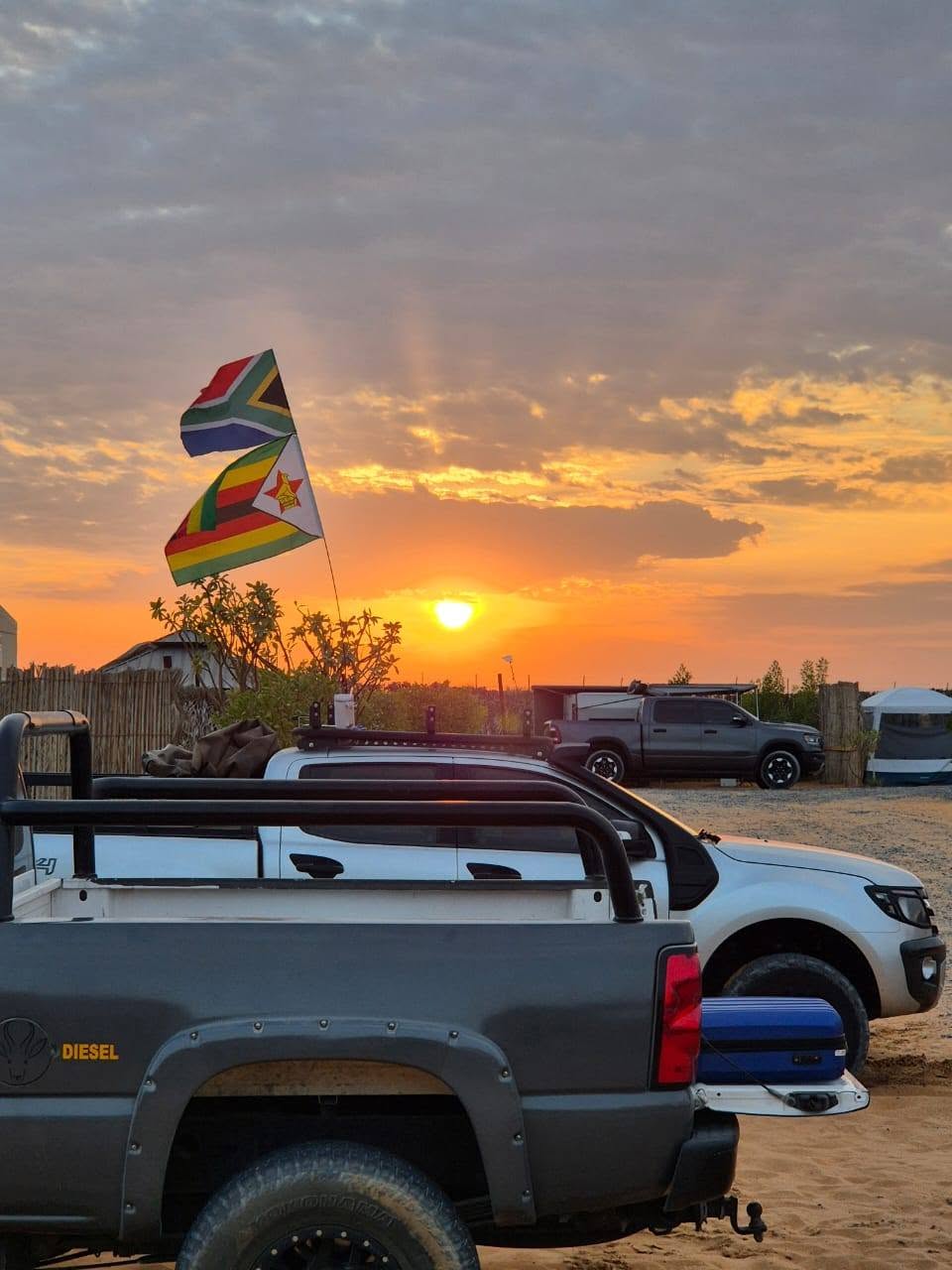 Flags flying at sunset