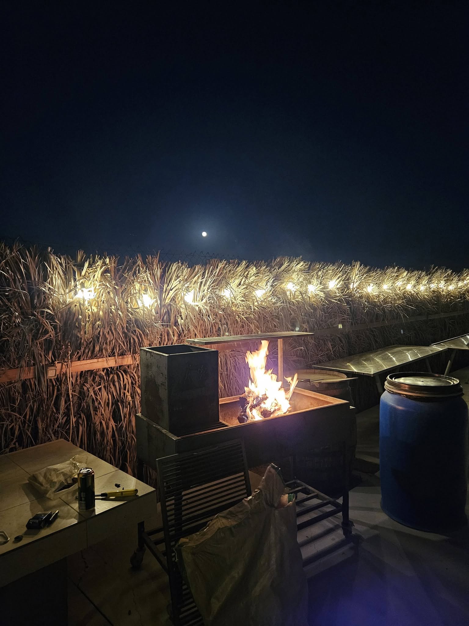 Moonlit braai under the string lights